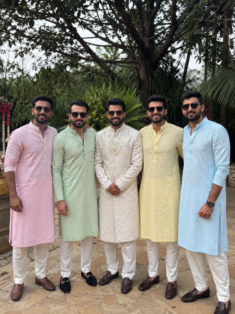 A coordinated pastel ethnic wear set showcasing modern Bollywood groomsmen outfit ideas