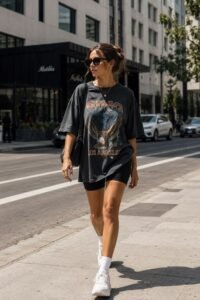 Laid-back summer college outfit with a white printed oversized tee and relaxed shorts