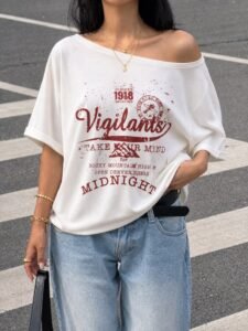 Off-the-shoulder styled oversized graphic tee paired with wide-leg pants